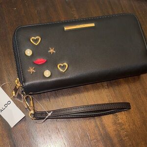 Aldo Black Wristlet with Gold and Red Accents